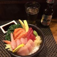 Chirashi · Assorted fresh sashimi on seasoned rice in a deep bowl. Served with miso soup and house sala...