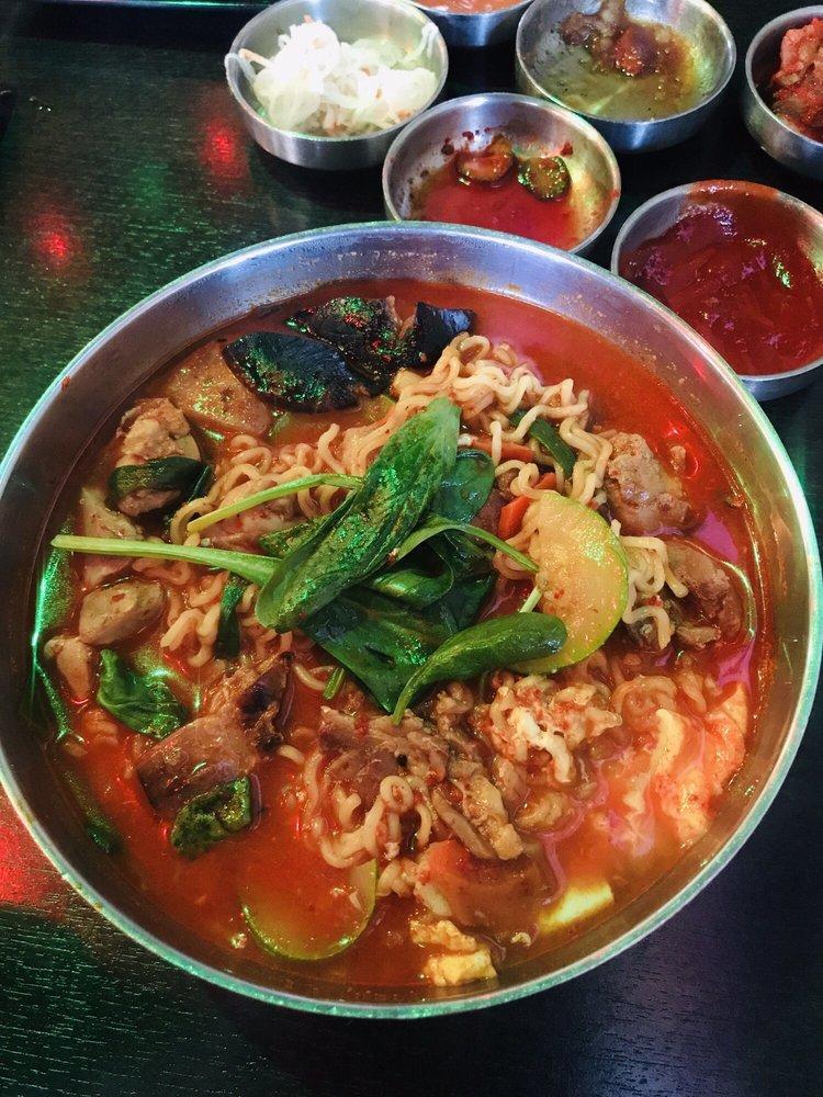 Hangover Ramen · Korean instant noodles, squash, shiitake mushroom, carrot, onion, scallion, egg, spinach in vegetable broth. Served with banchan. Choose a spice level: plain, mild, medium, spicy, extra spicy. Add extras, substitute inferno spice level for an additional charge. 