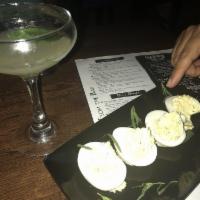 Deviled Eggs · Lemon, green onion and tarragon.