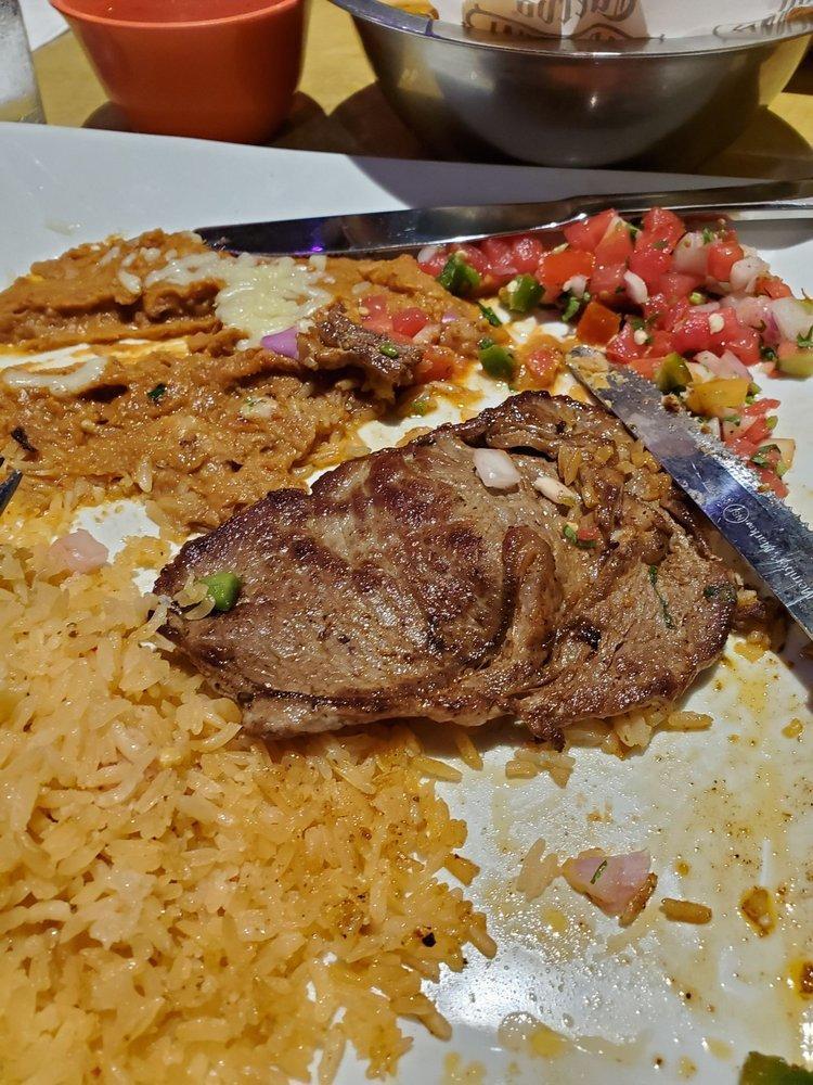 Carne Asada · Thinly sliced choice steak. Served with rice, beans and avocado salad.