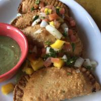 Empanadas · 4 assorted empanadas: chicken and beef. Served with a perico relish and an avocado dipping s...