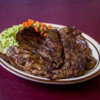 Cecina Estilo Guerrero · Grilled thin steak. Served with guacamole, pico de gallo, whole pinto beans, and handmade to...