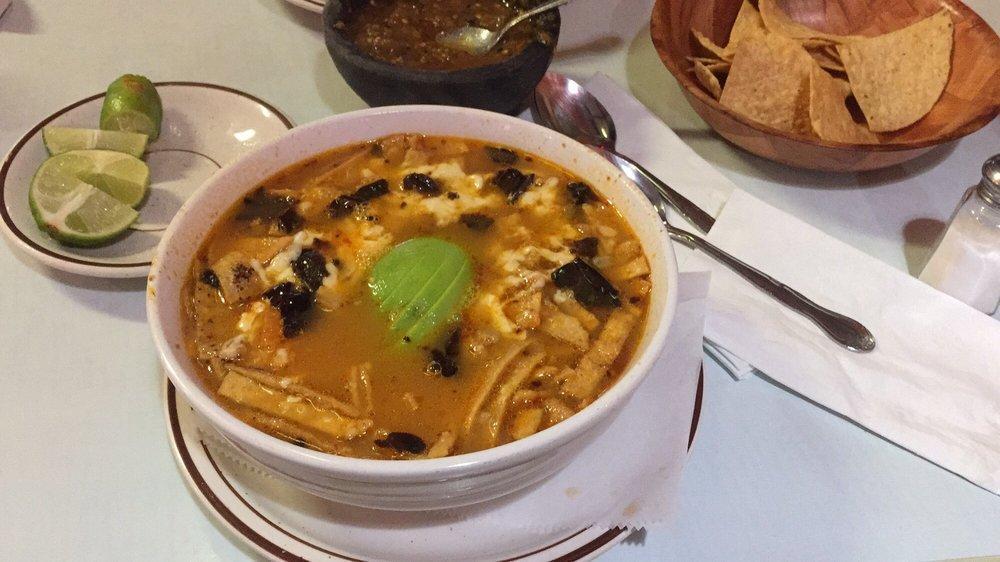 Sopa Azteca · Tortilla and chipotle soup. Topped with cheese and avocado.