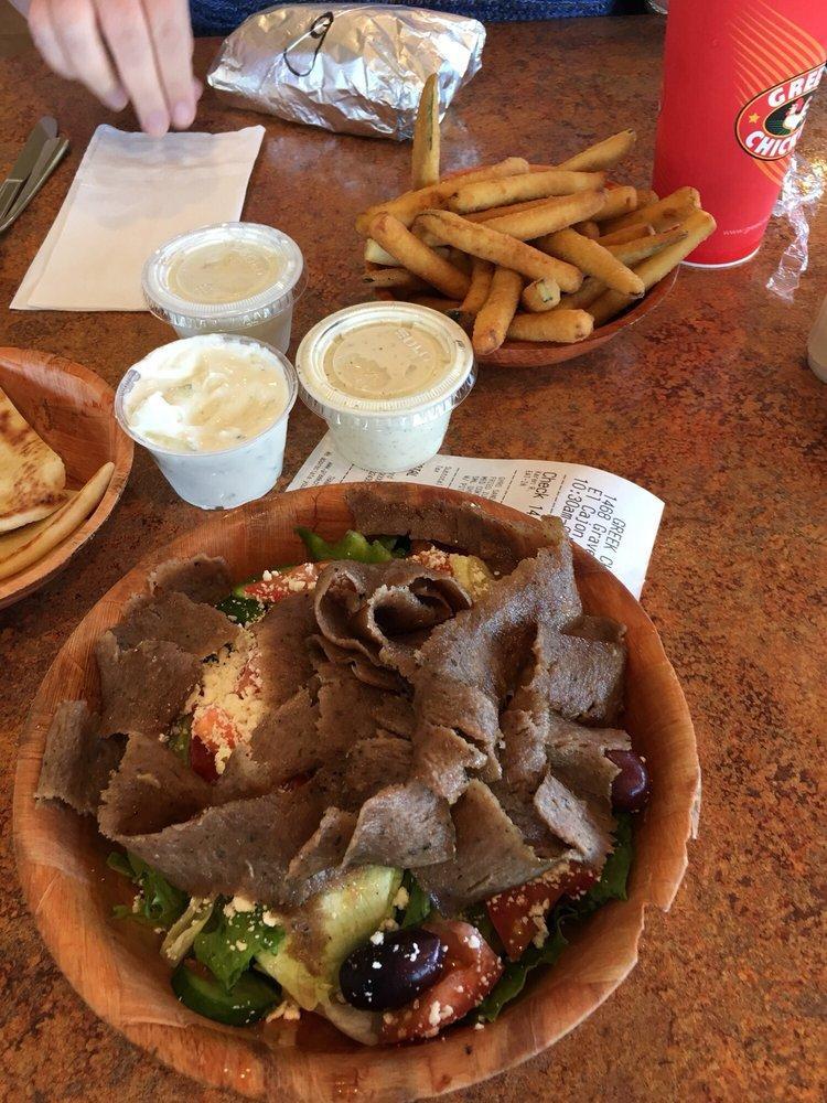 Gyros Salad · Greek Salad with Gyros Meat.  Choose from Small, Medium or Large (Large Serves 3-4). Salads come with lettuce, cucumber, onion, tomato, bell pepper, feta and olives. Dressing comes on the side when Togo. Gyros Sauce comes on the side.  Choice of Pita Bread or Garlic Bread.