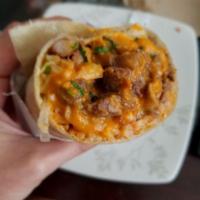 Asada Burrito · Steak, mexican rice, pinto beans, onion, cilantro, flour tortilla