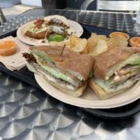 Carnitas Torta · Slow cooked pork, lettuce, tomato, onion, avocado, queso fresco, aioli, toasted telera bun, ...