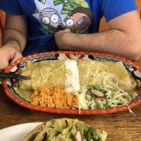 Loco Burrito · Choice of meat, rice, beans, onions, cilantro & cabbage smothered w/green tomatillo sauce, M...