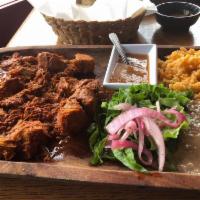 Cochinita Pibil · Slow cooked, marinated pork w/achiote flavor & Mayan herbs, green lettuce. Pickled red onion...