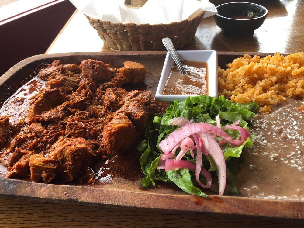 Cochinita Pibil · Slow cooked, marinated pork w/achiote flavor & Mayan herbs, green lettuce. Pickled red onions, habanero sauce.