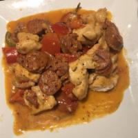 Chicken Scarpariello · Off-the-bone chicken with sweet and spicy sausage, sliced potatoes, cherry and vinegar peppe...
