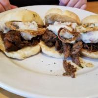 Pot Roast Sliders · 3 sliders on ciabatta rolls with truffle oil mashed potatoes and fried onions.