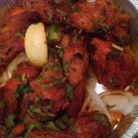 Tandoori Chicken Wings · Chicken wings marinated in yogurt, lemon and herbs, then barbecued in tandoor.