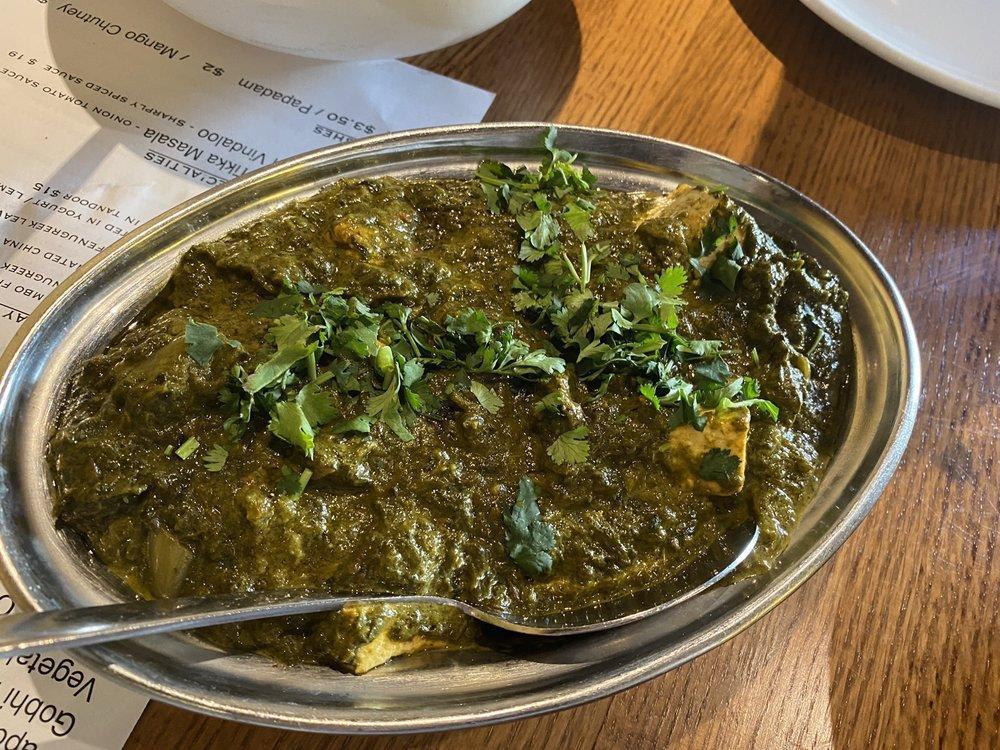 Palak Paneer · Homemade cheese cubes cooked with fresh chopped spinach and herbs. Served with basmati rice. Gluten free.
