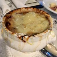 Bistro French Onion Soup · Caramelized onion, beef broth, crostini, Gruyere and Swiss cheese.
