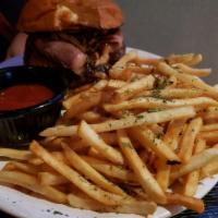 Brisket Burger · Cheddar cheese, onion straws and BBQ sauce.