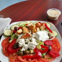 Greek Salad · Lettuce, tomato, onion, black olives and French feta cheese served with house dressing.