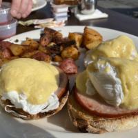 Eggs Benedict · Poached eggs on an English muffin with Canadian bacon and our own hollandaise sauce served w...