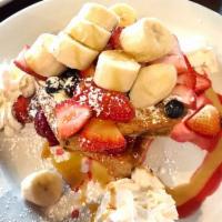 Stuffed French Toast · Fresh bananas sauteed cinnamon and sugar made into a sandwich and topped with whipped cream.