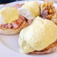 Irish Eggs Benedict · Eggs benedict with corn beef hash topped with hollandaise sauce. Served with home fries.