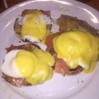 Salmon Eggs Benedict · Eggs benedict with smoked salmon topped with hollandaise sauce. Served with home fries.