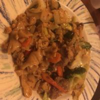 Drunken Noodle · Stir fried big rice noodle with chili garlic basil sauce and vegetables.