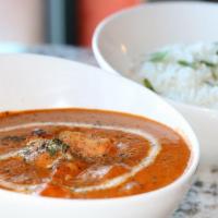 Butter Chicken · Cut chicken slowly cooked with butter, fenugreek leaves in rich creamy tomato sauce 
