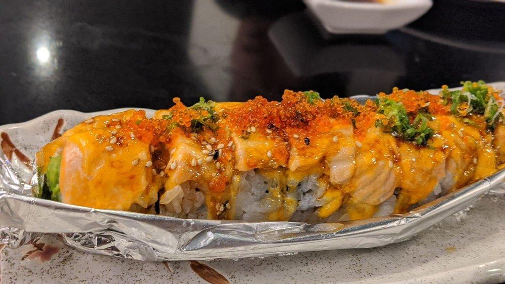 Lion King Roll · Avocado, crab meat, topped with salmon, baked, unagi and special sauce.