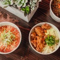 Tori Nanban · Karaage fried chicken, tangy soy glaze, shredded cabbage, egg, pickled cucumbers.