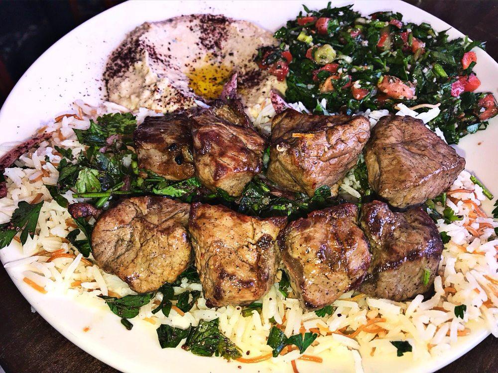 Lamb Kabob · Parsley, onion, sumac, basmati rice. Served with pita bread + your choice of one dip & one salad - hummus, spicy hummus, baba ghannouj | open sesame salad, fattoush, tabouleh