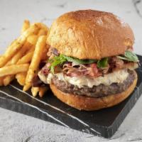 Fondue Burger · Homemade burger stuffed with swiss cheese fondue, bacon, caramelized onions, mushrooms, and ...