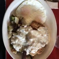 Chicken Fried Steak · Chicken fried steak covered with our gravy, served with two eggs as you like them, 