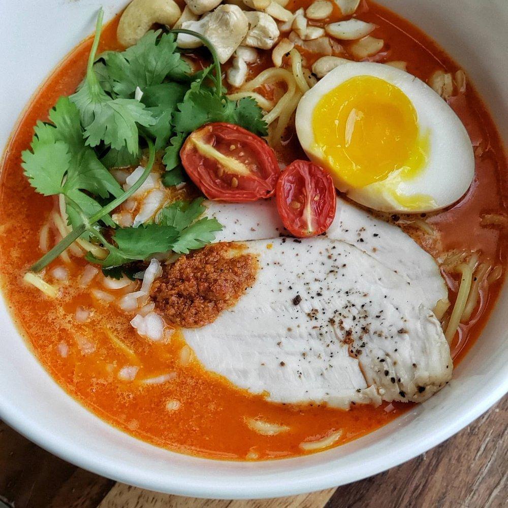 Paitan Ramen · Creamy broth ramen made from a mixture of chicken and pork broth. Comes with arugula, aji tama, umami egg, red onions, and your choice of chicken or pork chashu.