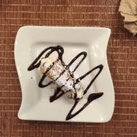 Cannoli · Imported from Sicily. Small chocolate coated cannoli in a ricotta cream.