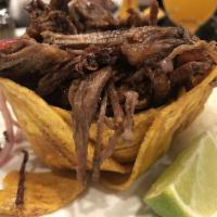 Vaca Frita · Famous crispy seared shredded flank steak, marinated with rumba’s mojo, cooked with red onio...