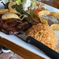 Carne Asada · Premium flank steak, marinated with our house recipe and grilled to your liking. Served with...