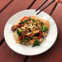 Tofu Peanut Bowl · Brown rice & millet, choice of tofu or tempeh, broccoli, peppers, kale, carrots, cabbage, pe...