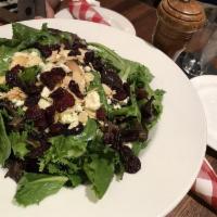 Bada Bing Salad · Field greens, toasted almonds, Gorgonzola, and dried bing cherries with raspberry vinaigrette.