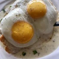 Country Biscuit Plate · Sausage gravy and 2 sunny-side eggs over toasted buttermilk biscuit. Ask for vegetarian gravy?