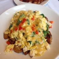 Grilled Chicken Scramble · A savory blend of grilled chicken, spinach, red pepper, mushroom and goat cheese crumbles to...