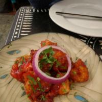 Lasuni Gobi · Deep fried, crisp cauliflower florets tossed in a fiery garlic and tomato sauce.