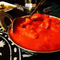 Chicken Makhani · Diced chicken in a buttery tomato curry with whole and ground spices.