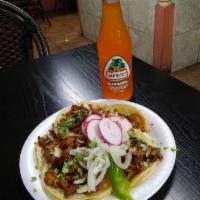 Tacos · tacos are served with cilantro and onion and salsa on the side