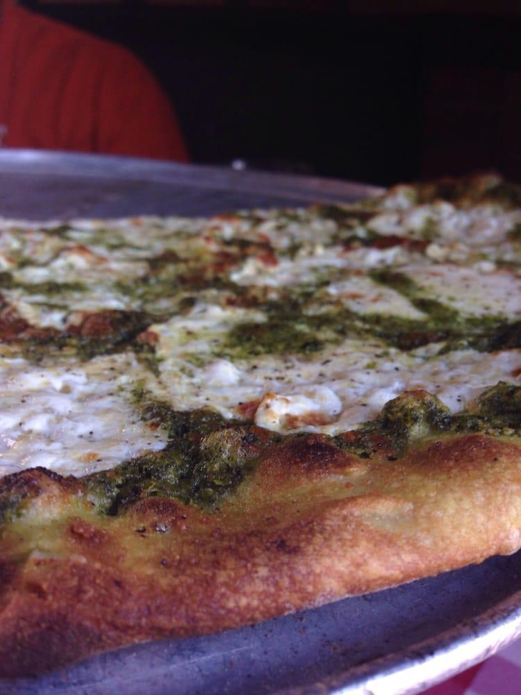 Pesto Pizza · Hand sliced mozzarella and basil pesto sauce drizzle. Topped with our signature cheese and spice blend. Nut free.