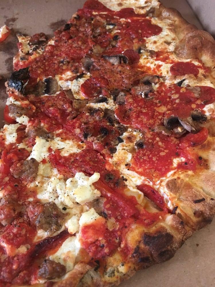 Brooklyn Bridge Pizza · Oven-roasted red peppers, creamy ricotta cheese and hand pinched Italian sausage, a top our traditional pizza.