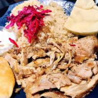 Chicken Shawarma Sandwich · Shredded marinated chicken cooked on a rotisserie. Comes with tomatoes, cucumbers, lettuce, ...