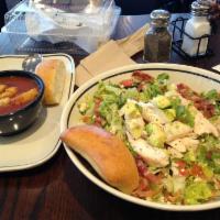 Chopped Salad · Romaine blend, grilled chicken, bacon, bleu cheese, avocado, tomato, green onion, and house ...