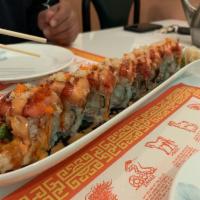 Dragon Roll · In: Shrimp tempura, crab meat. Out: Unagi, avocado with eel sauce.