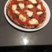 Margherita Pizza · Tomato sauce, buffalo mozzarella and basil. Baked in our brick oven with house-made mozzarel...
