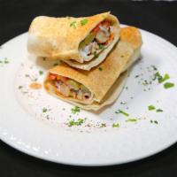 Chicken Shawarma Sandwich · Thinly sliced chicken pieces marinated for a perfect taste topped with tomatoes, pickles, an...