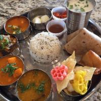 Thali · Full meal with 2 curry, 1 dal, rice, roti, appetizer, and dessert.